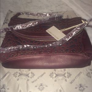 Isabelle Fiore laser cut crossbody leather bag.